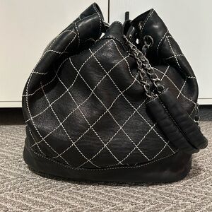 CHANEL Black Quilted Leather Drawstring Bucket Bag with Silver Chain